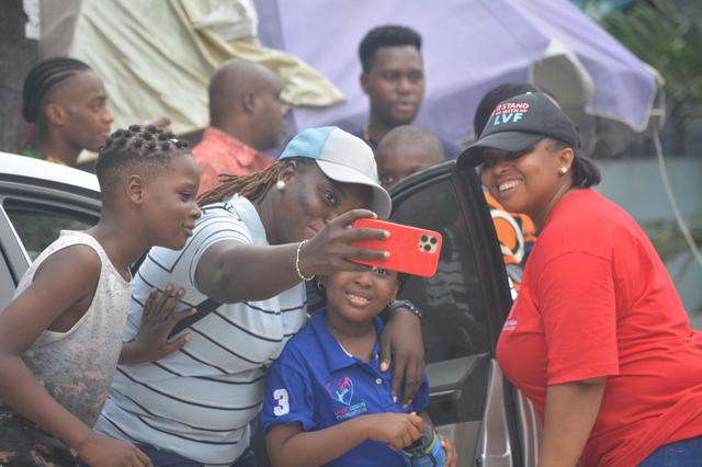 Volunteers interacting with community members